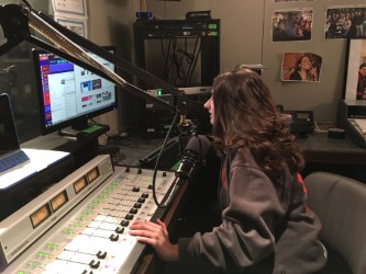 Sophomore Kate Adriani gets content ready for her before her show. WICR has won awards in the past for students' outstanding performance on their shows. Students develop a wide range of knowledge through the use of the radio station and the equipment.